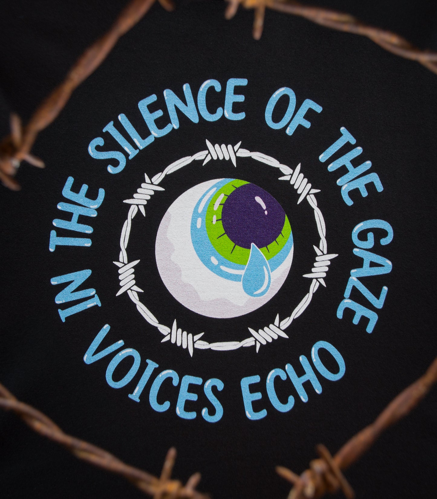 Close-up of the LOUD GAZE design with an depiction of an Eye surrounded by barbed wire