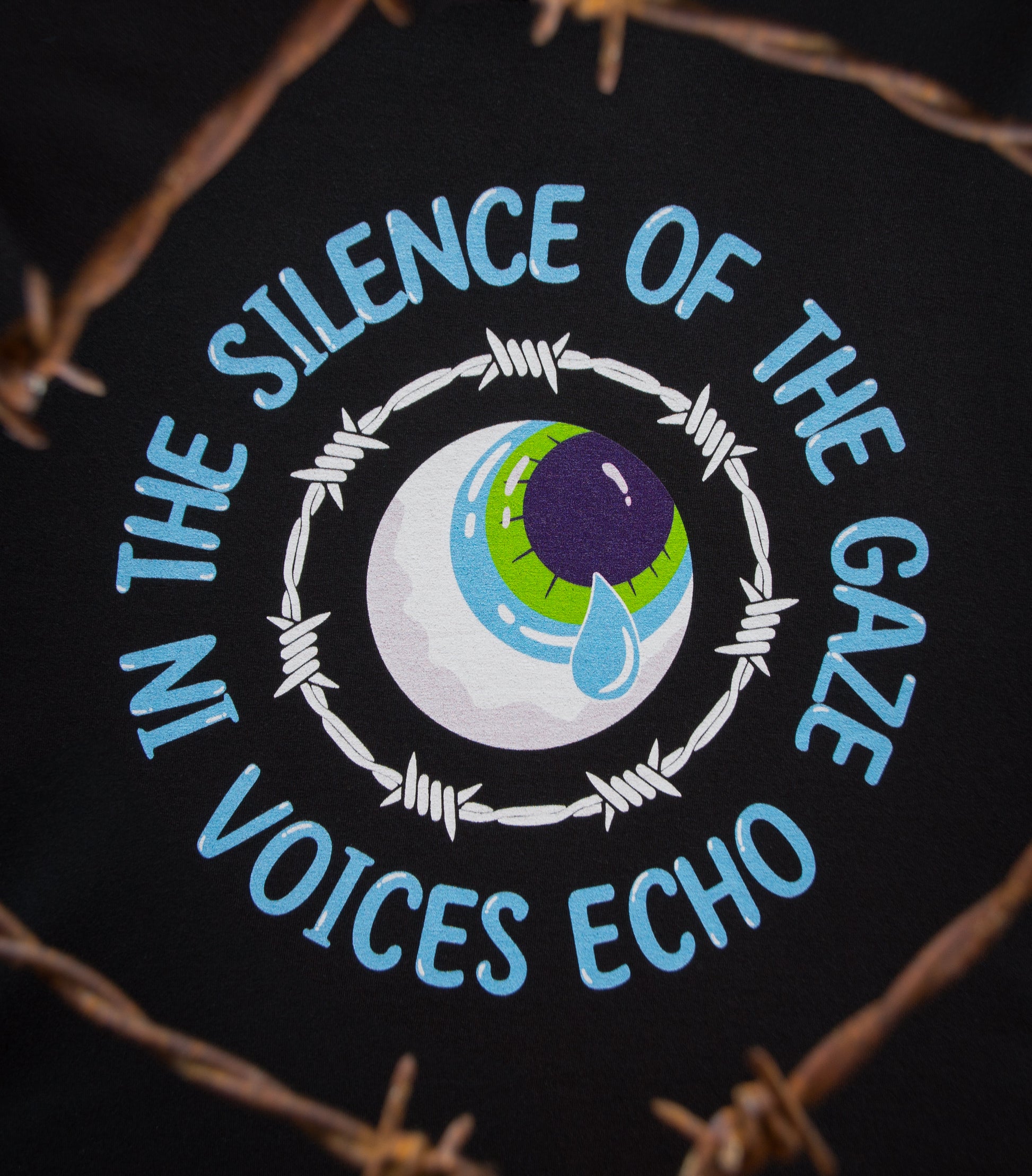 Close-up of the LOUD GAZE design with an depiction of an Eye surrounded by barbed wire