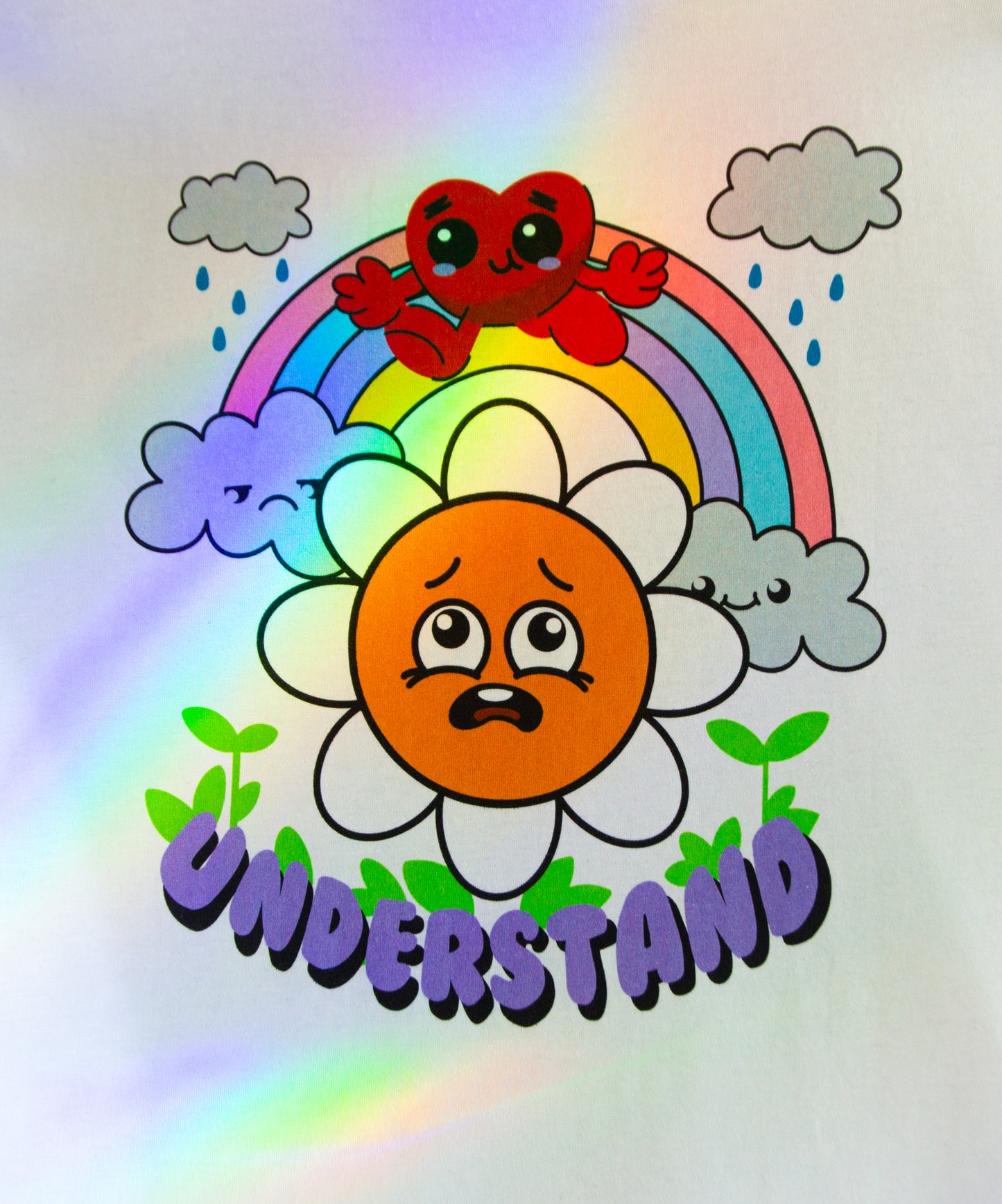 Close-up of the UNDERSTAND design with a cartoon character with rainbow clouds and flowers shined on by rainbows